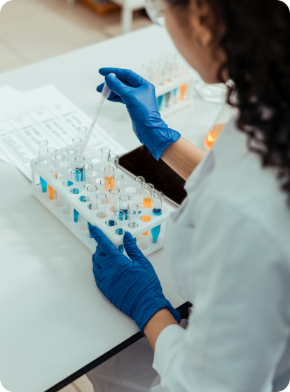 Physician with rubber gloves, inserting DNA strains into their respective housings for accurate results.